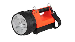A heavy-duty flashlight with a large bulb and a red body and handle and black base A heavy-duty flashlight with a large bulb and a red body and handle and black base