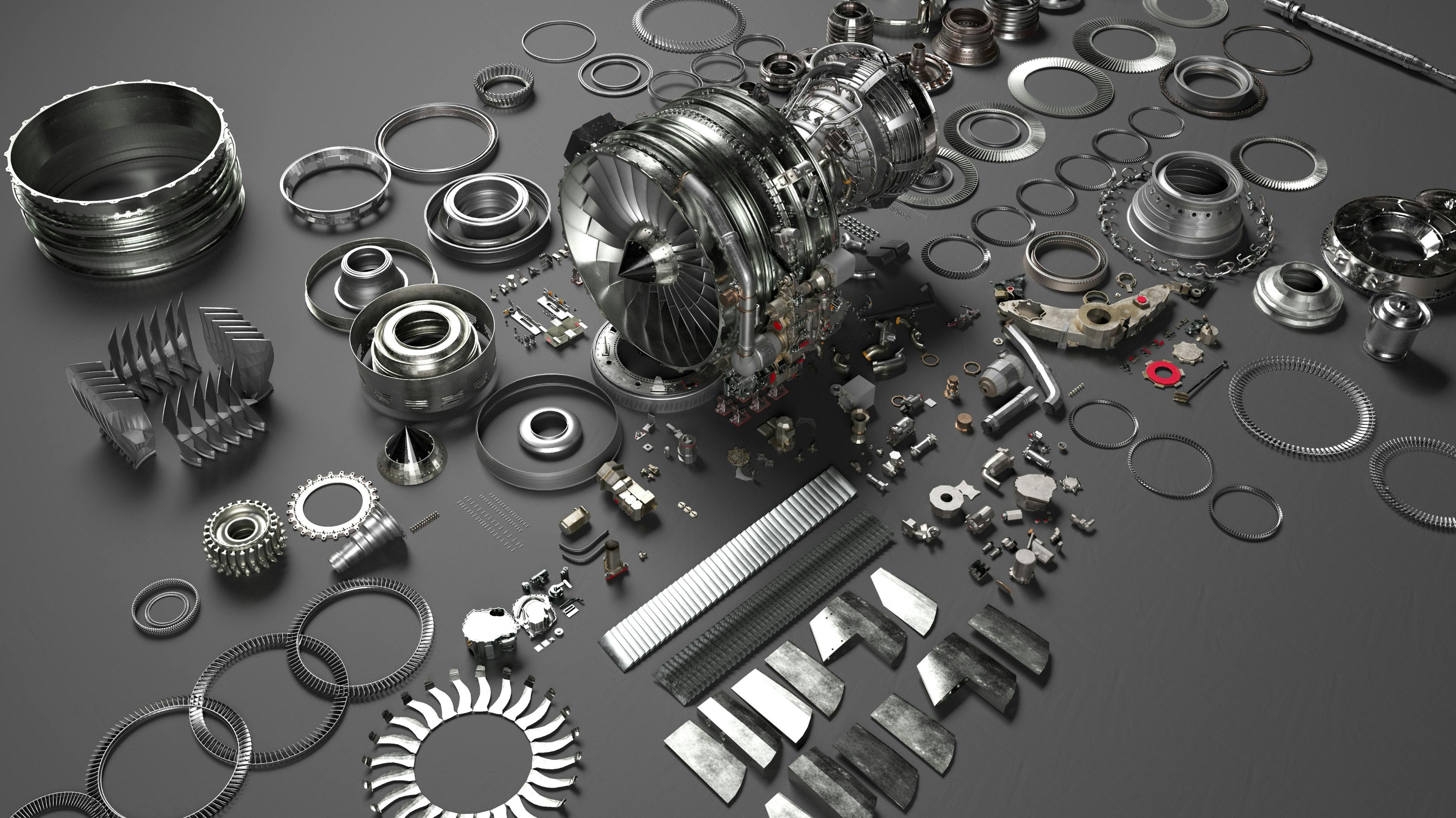 A collection of metal parts spread out on a gray surface