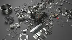 A collection of metal parts spread out on a gray surface A collection of metal parts spread out on a gray surface