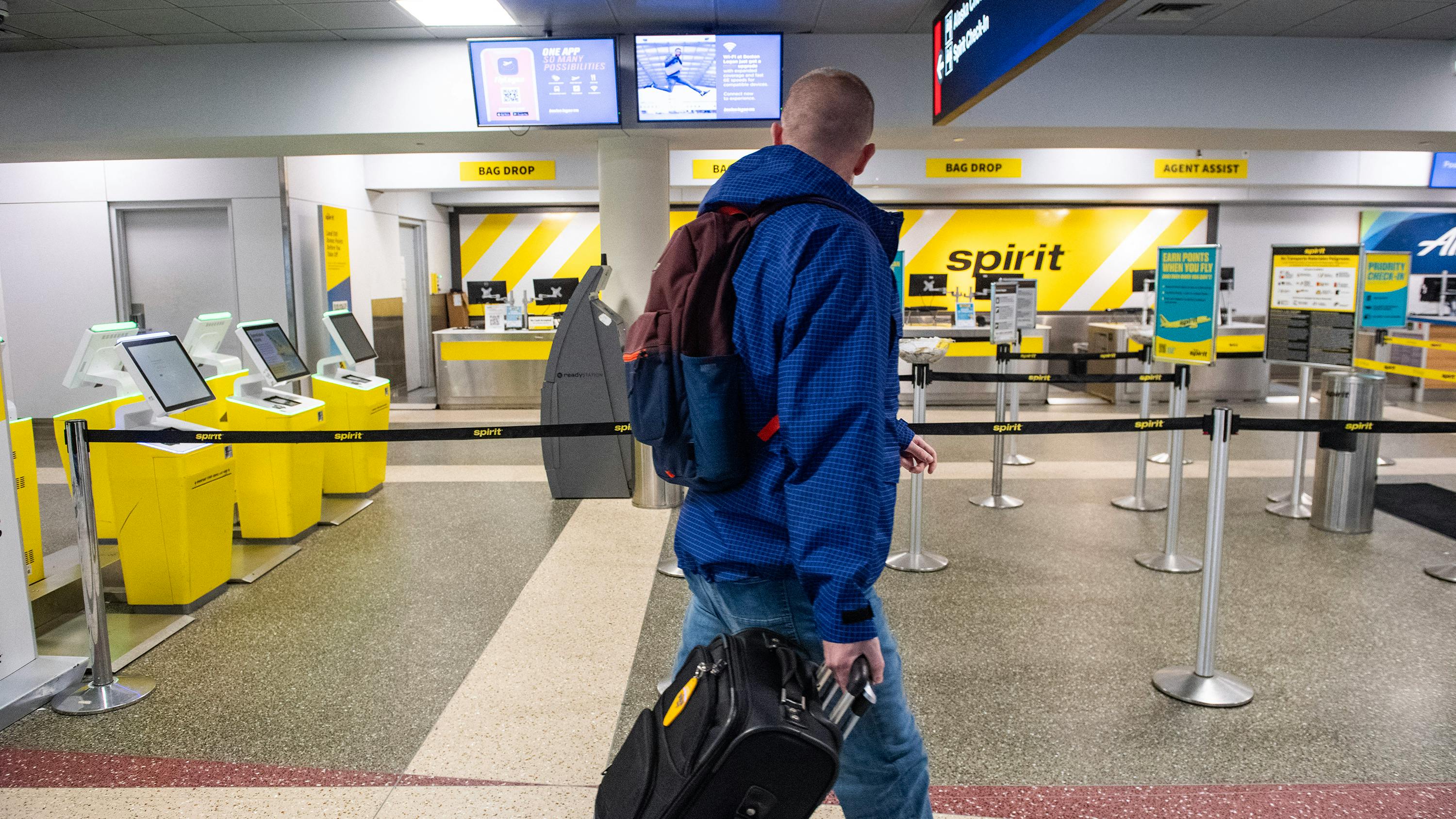The bag drop and customer service counters at the departures terminal for Spirit airlines sit empty as operations ceased for the company at Logan Airport on Saturday, May 2, 2026, in Boston. (Joseph Prezioso/AFP/Getty Images/TNS)