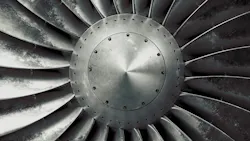 A zoomed-in photograph of an aircraft engine A zoomed-in photograph of an aircraft engine