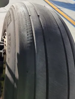 A smooth tire showing significant wear A smooth tire showing significant wear