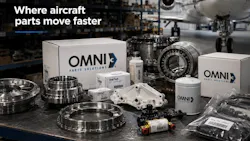 A collection of mechanical parts on a table with some labeled 'Omni Parts Solutions' with floating white text at the top of the image that reads: Where aircraft parts move faster A collection of mechanical parts on a table with some labeled 'Omni Parts Solutions' with floating white text at the top of the image that reads: Where aircraft parts move faster