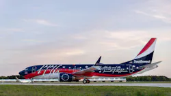 An airplane with red, white, and dark blue coloring and text on the side that reads '1776' and “Life, Liberty and the pursuit of Happiness” An airplane with red, white, and dark blue coloring and text on the side that reads '1776' and “Life, Liberty and the pursuit of Happiness”