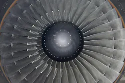 A close-up photograph of an airplane engine A close-up photograph of an airplane engine
