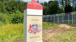 A border marking with a coat of arms and text that reads 'Latvijas Republika'