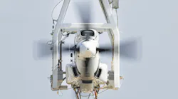 A close-up shot of an aircraft propulsion system, showing the engine and propeller