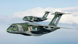 Embraer A pair of camouflage-printed military aircraft flying in the sky with 'KC-390' printed on the sides