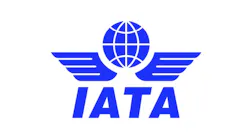 A bright blue logo featuring illustrations of a globe and pilot's wings, with text that reads: IATA
