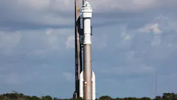 A spacecraft standing at a launch station outside