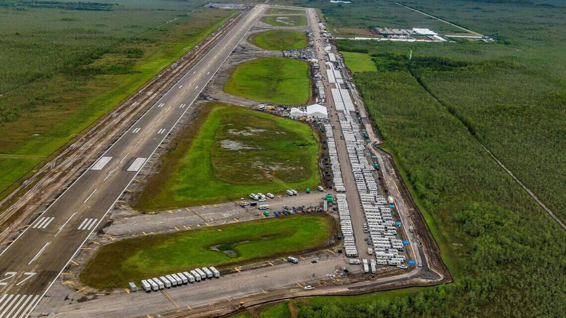Aerial view of the runway on the remote Miami-Dade County airport that the state of Florida converted to the Alligator Alcatraz detention camp for immigration offenders. Miami-Dade has resumed control of the airfield after the immigration detention camp has been dismantled.