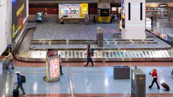 Travelers make their way through the baggage claim at Harry Reid International Airport on Tuesday, Nov. 11, 2025, in Las Vegas.