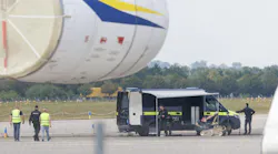 Police investigators work on the tarmac with a robot that is capable, amongst other things, of defusing explosives, near to Ukrainian Antonov cargo plane at Leipzig/Halle Airport on Aug. 5, 2026, near Leipzig, Germany. Airport workers reportedly discovered a drone yesterday on the tarmac near an Antonov at the airport that was equipped with an explosives detonator and an unidentified substance. Additionally, a DHL cargo plane that took off from the airport late last night collided with a small object, causing minor damage. (Jens Schlueter/Getty Images/TNS)