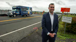 Michael Shea, Connecticut Airport Authority executive director and CEO, discusses the new Lot 3 parking area as a BDL sPARK shuttle bus passes by at Bradley International Airport.