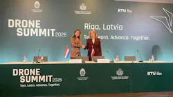 Latvian Prime Minister Evika Silina (R) and Dutch Defense Minister Dilan Yesilgoez-Zegerius sign a declaration on closer drone cooperation.