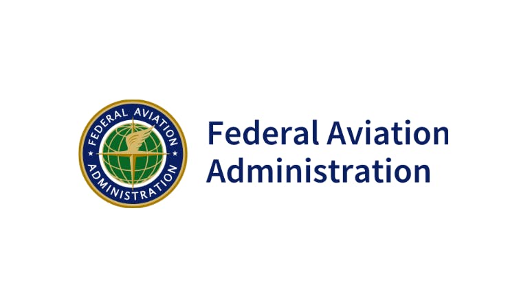 A logo with an illustration of a globe and text that reads: Federal Aviation Administration