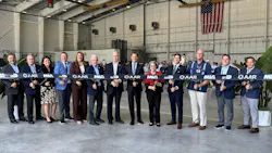 A line of people wearing business attire holding onto a ribbon that says 'AAR' and 'MIA' on it