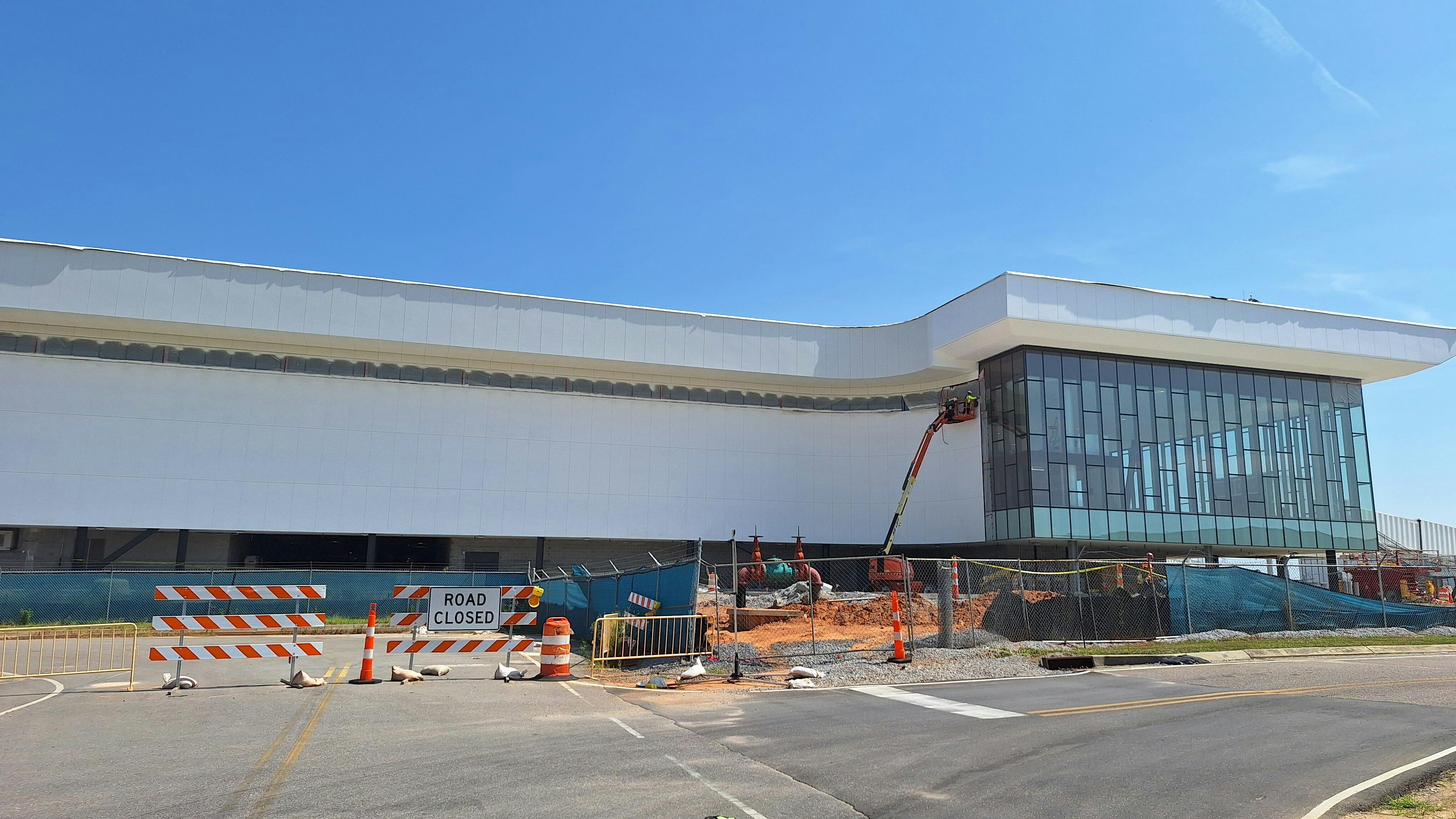 A view of the side of the new Mobile International Airport terminal on Aug. 19, 2026, shows that work on exterior cladding has progressed.