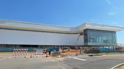 A view of the side of the new Mobile International Airport terminal on Aug. 19, 2026, shows that work on exterior cladding has progressed.