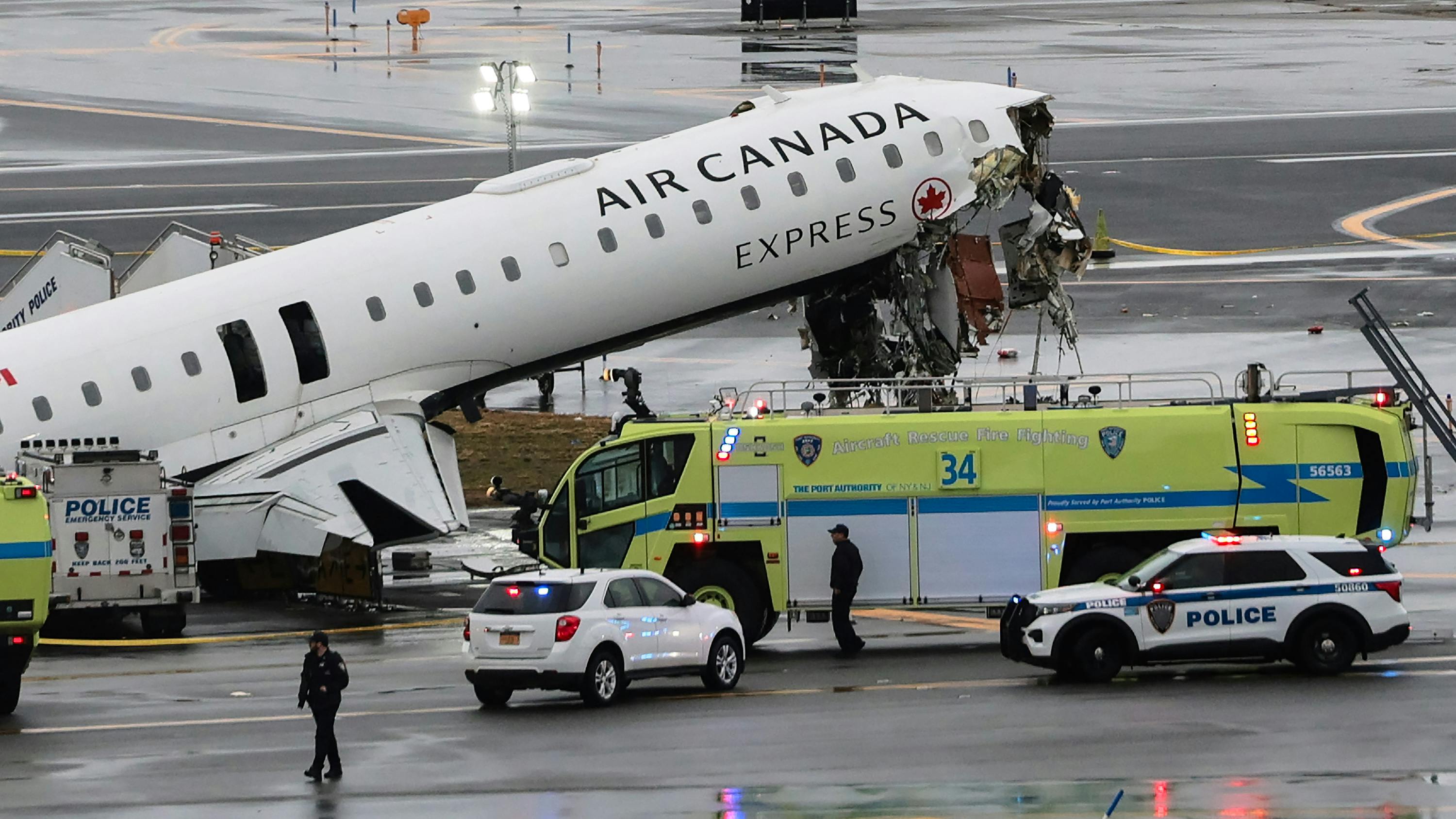 An Air Canada Express CRJ-900 sits on the runway after colliding with a Port Authority fire truck at LaGuardia Airport in March in New York City.