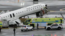 An Air Canada Express CRJ-900 sits on the runway after colliding with a Port Authority fire truck at LaGuardia Airport in March in New York City.
