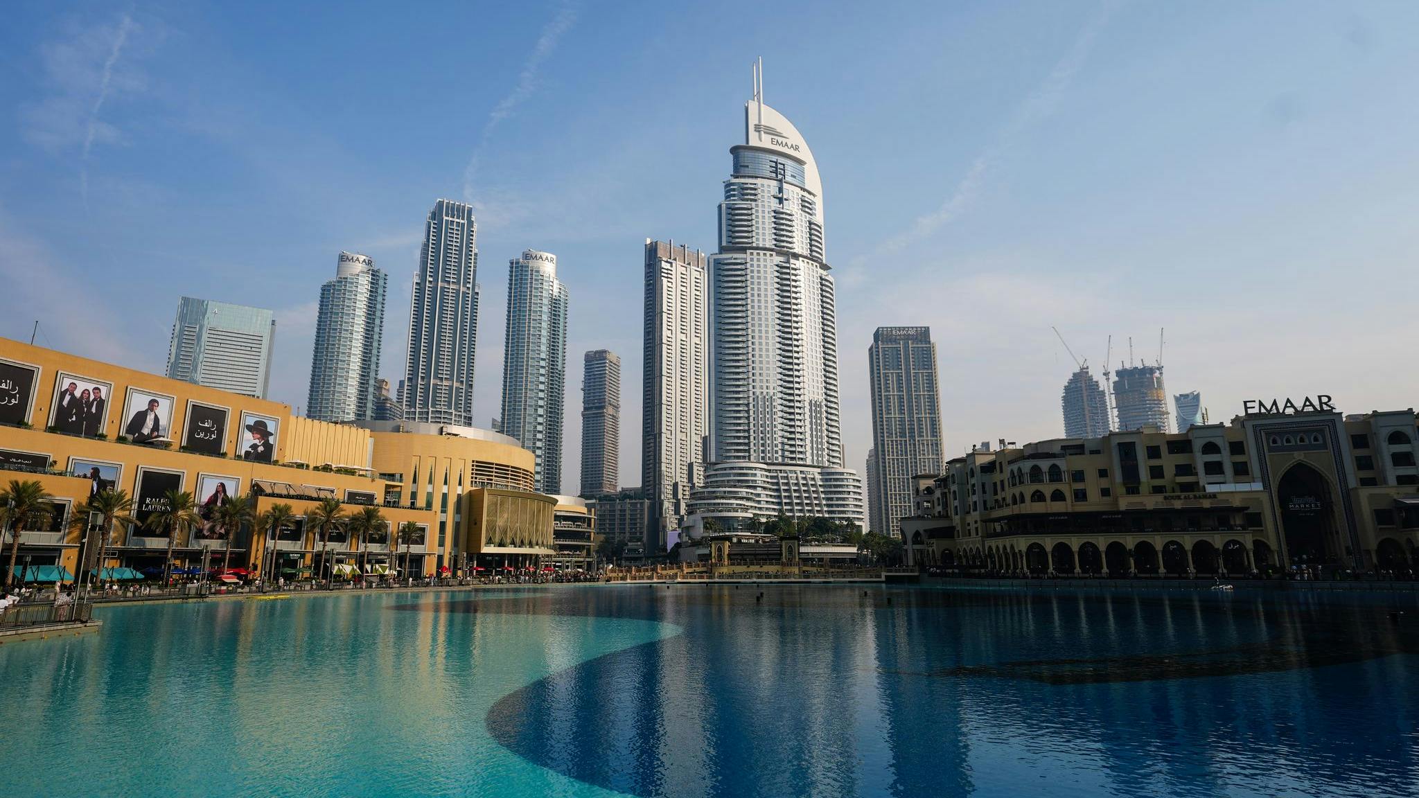 A landscape view of a city with large buildings and a body of water