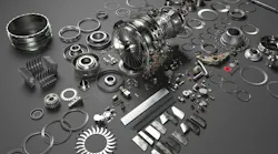 A collection of metal parts on a gray table