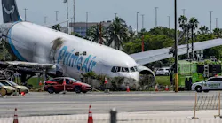 Investigators continue working on Tuesday, Sept. 8, 2026, after an Amazon Prime Air Boeing 767 went through a fence and hit vehicles at Miami International Airport on Sunday. Five people were killed.