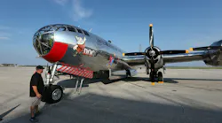 A vintage military plane with chrome-like livery and an illustration of a dwarf, with text that reads: DOC