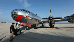 A vintage military plane with chrome-like livery and an illustration of a dwarf, with text that reads: DOC