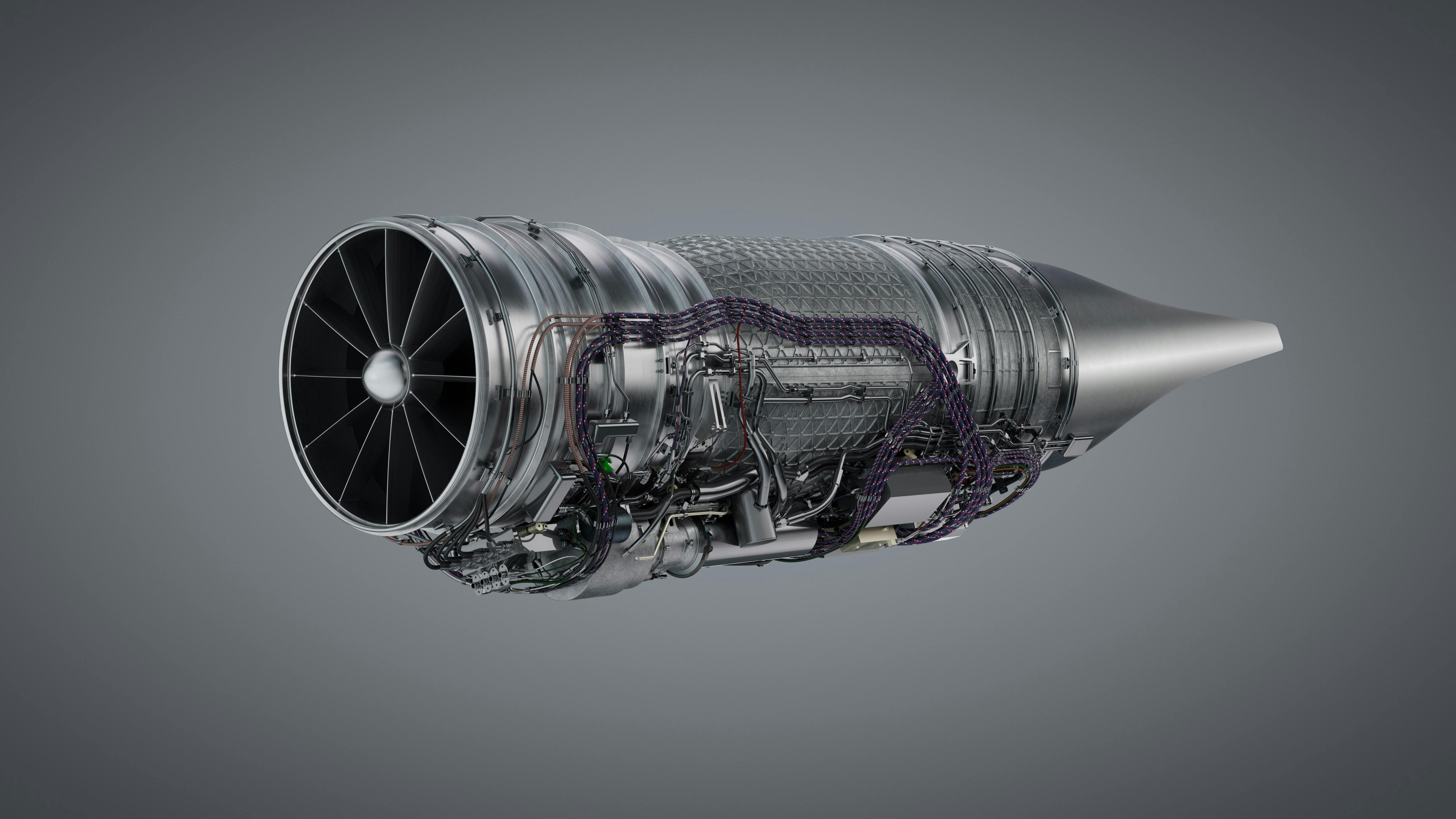 An airplane engine in front of a gray background