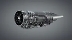 An airplane engine in front of a gray background