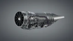 An airplane engine in front of a gray background