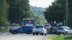 Firefighters respond to the site of an F-16 crash in Grand Traverse County, seen here at the entrance to the neighborhood where the fighter jet came down on Thursday, Sept. 17, 2026.