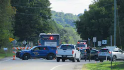 Firefighters respond to the site of an F-16 crash in Grand Traverse County, seen here at the entrance to the neighborhood where the fighter jet came down on Thursday, Sept. 17, 2026.