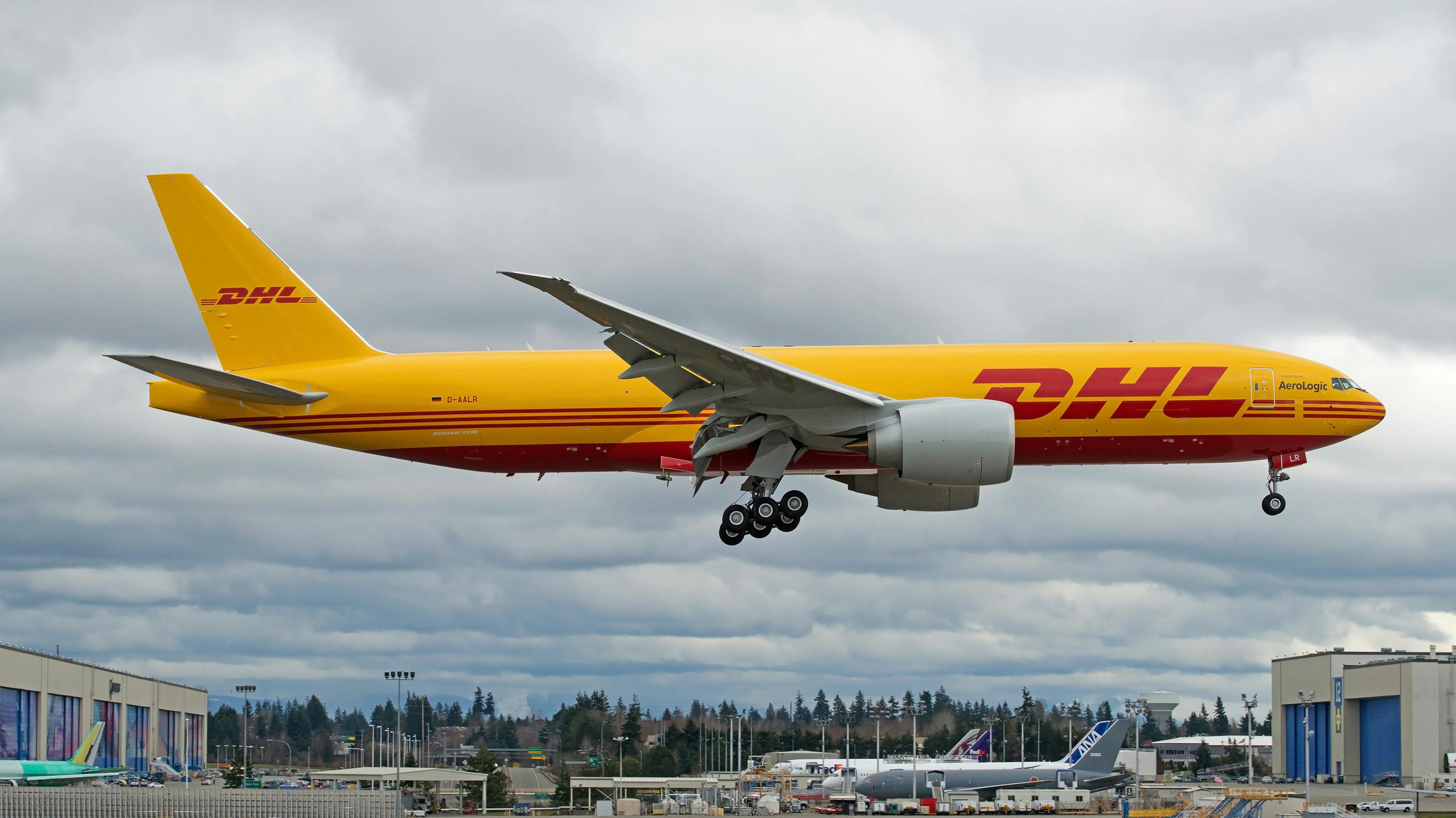 A DHL Aerologic Boeing 777 freighter cargo plane landing.