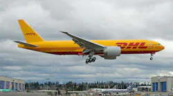 A DHL Aerologic Boeing 777 freighter cargo plane landing.