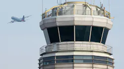 An American Airlines Airbus A319 airplane takes off past the air traffic control tower at Ronald Reagan Washington National Airport in Arlington, Va., on Jan. 11, 2023.