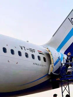 Crew Spraying An Aircraft Before Departure To Italy