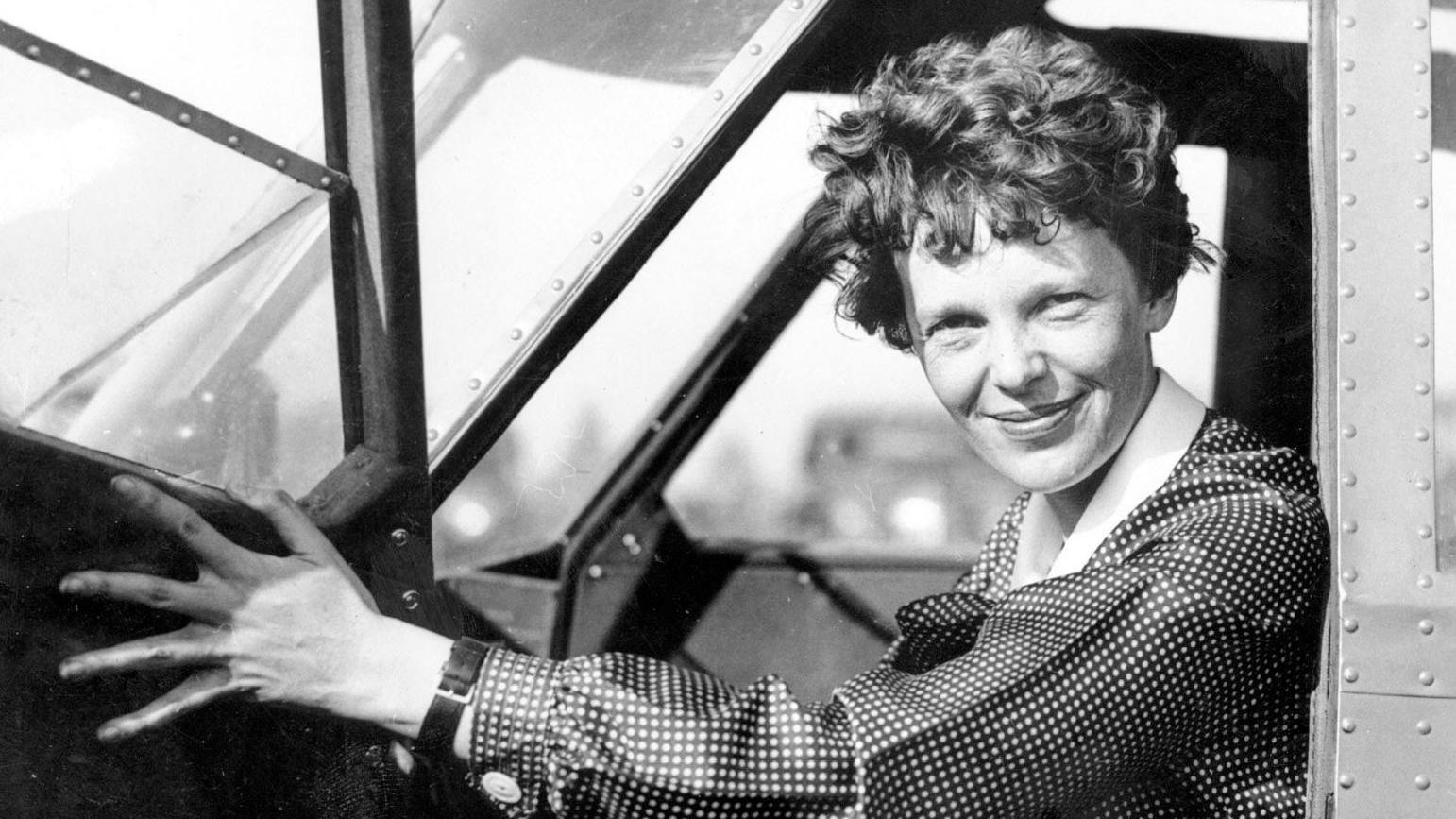 American aviator Amelia Earhart sits in the cockpit of an aircraft. Researchers have concluded an expedition to Nikumaroro Atoll in the Pacific in an effort to shed light on the disappearance of the pioneering aviator and her Lockheed Electra 10E.