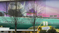 A MAX fuselage with a Spirit AeroSystems logo sits on a train at the Boeing factory in Renton, Washington, on Friday, March 1, 2024.